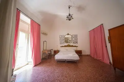 Letto o letti in una camera di Appartamento in centro con terrazzo per 11 persone