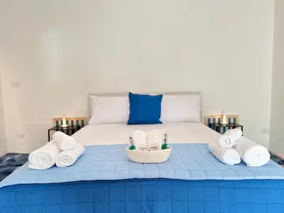 Letto o letti in una camera di HOME BUCISCA - Your days of relaXation