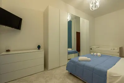 Letto o letti in una camera di A casa di amici