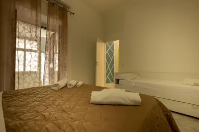 Letto o letti in una camera di A casa di amici