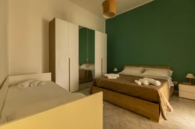 Letto o letti in una camera di A casa di amici