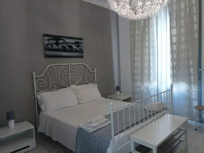 Letto o letti in una camera di B&B Il Siciliano