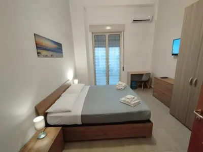 Letto o letti in una camera di GiGi Affittacamere