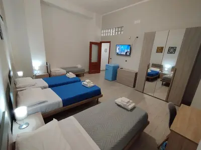 Letto o letti in una camera di GiGi Affittacamere