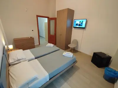 Letto o letti in una camera di GiGi Affittacamere