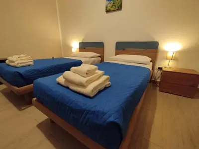 Letto o letti in una camera di GiGi Affittacamere