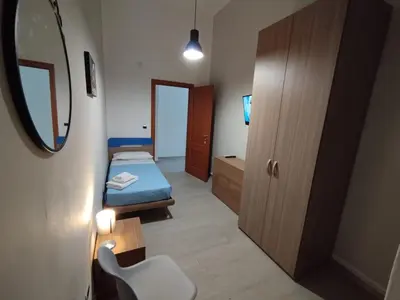 Letto o letti in una camera di GiGi Affittacamere