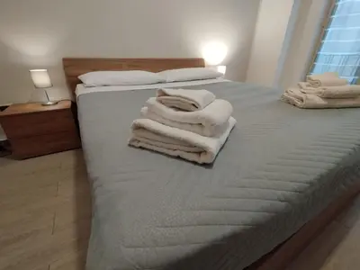 Letto o letti in una camera di GiGi Affittacamere
