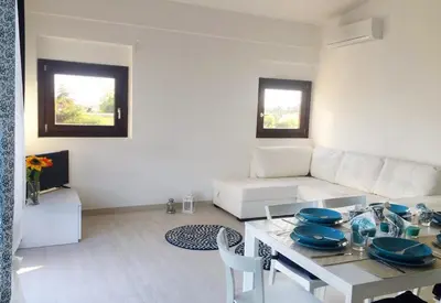 Area soggiorno di Avola Attico Vista Mare - Affittimoderni