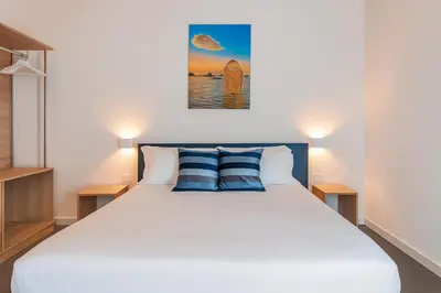 Letto o letti in una camera di Hotiday Apartments Siracusa