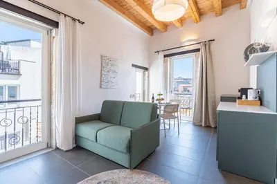 Area soggiorno di Hotiday Apartments Siracusa