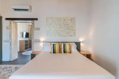 Letto o letti in una camera di Hotiday Apartments Siracusa