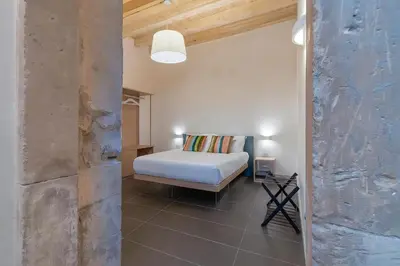 Letto o letti in una camera di Hotiday Apartments Siracusa
