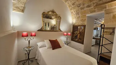 Letto o letti in una camera di Dammuso Aureo