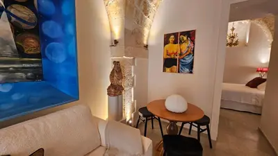 Letto o letti in una camera di Dammuso Aureo