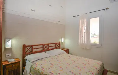 Letto o letti in una camera di Villa Adele