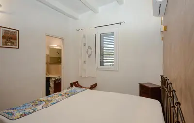 Letto o letti in una camera di Villa Adele