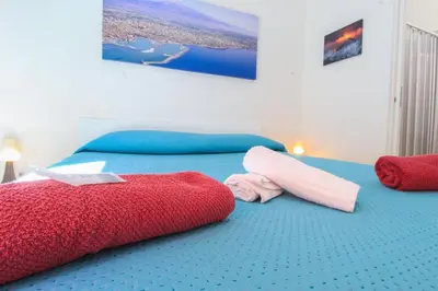Letto o letti in una camera di bed and fly near 2 fontanarossa 800mt aeroporto catania
