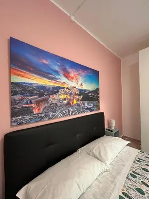 Letto o letti in una camera di Riflessi su Ibla