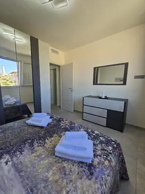 Letto o letti in una camera di ViChi