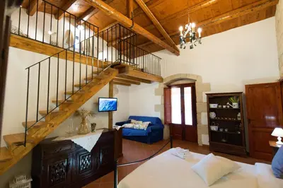 Letto o letti in una camera di Donna Tommasa