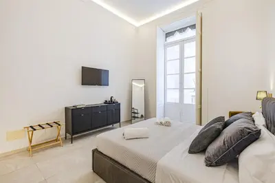 Letto o letti in una camera di Dione Deluxe Rooms Ortigia