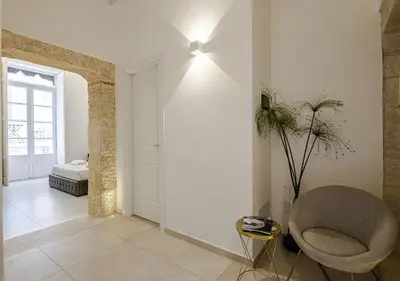 Letto o letti in una camera di Dione Deluxe Rooms Ortigia