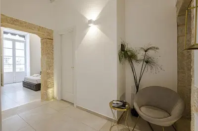 Area soggiorno di Dione Deluxe Rooms Ortigia