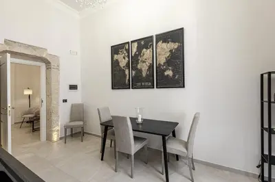Area soggiorno di Dione Deluxe Rooms Ortigia