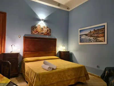 Letto o letti in una camera di Artemide