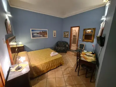 Letto o letti in una camera di Artemide