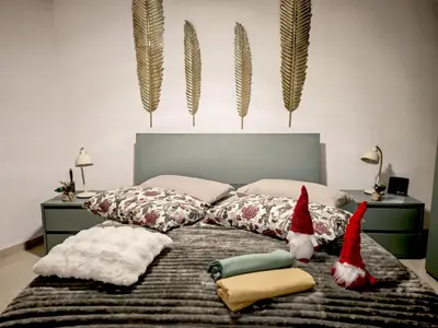 Letto o letti in una camera di Ortigia Domus
