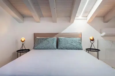 Letto o letti in una camera di GuestHost - San Giuliano 81