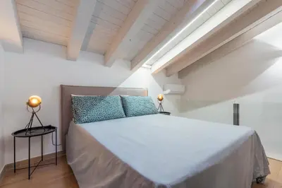 Letto o letti in una camera di GuestHost - San Giuliano 81