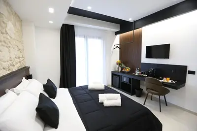 Letto o letti in una camera di B&B Il Moro Luxury Rooms