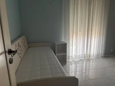 Letto o letti in una camera di Mariuccia Home