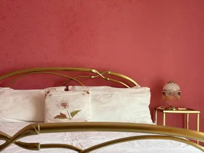 Letto o letti in una camera di Mariuccia Home
