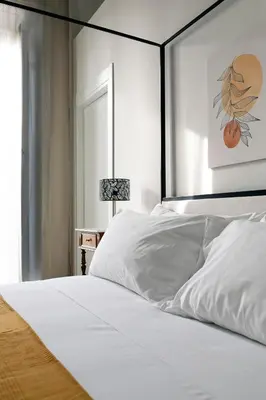 Letto o letti in una camera di Myth Apartments
