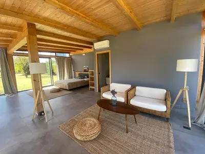 Area soggiorno di Glass Lodge Caponegro