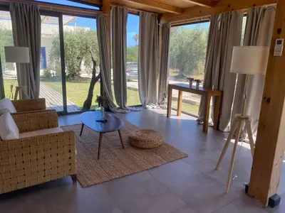 Area soggiorno di Glass Lodge Caponegro