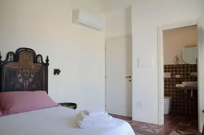 Letto o letti in una camera di Garibaldi Rooms - Boutique Stay with Breakfast included - Jacuzzi available