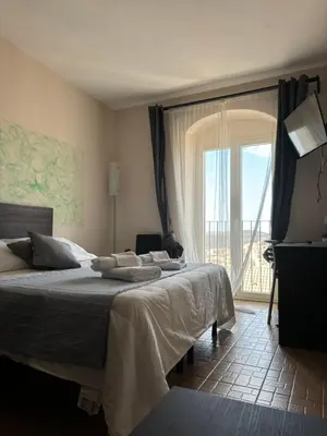 Letto o letti in una camera di bedbreakfast DINASTIA