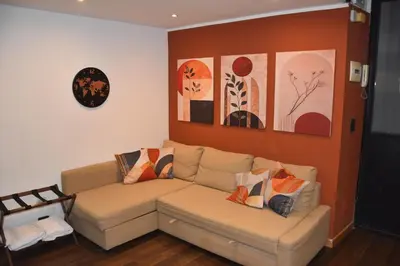 Area soggiorno di Ivy Central Apartment - Casa vacanze Catania centro