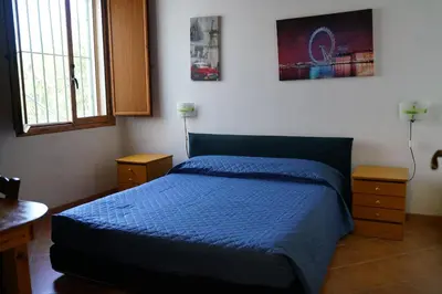 Letto o letti in una camera di Villa Belfronte