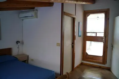 Letto o letti in una camera di Villa Belfronte