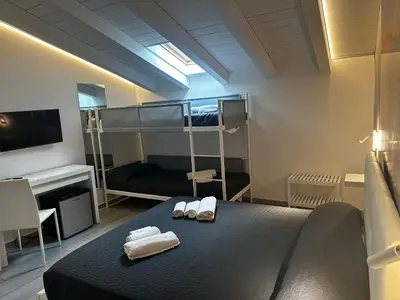 Letto o letti in una camera di Le Tre Anfore