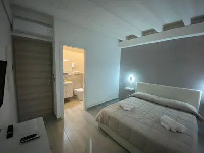 Letto o letti in una camera di Le Tre Anfore