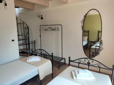 Letto o letti in una camera di La Clementina