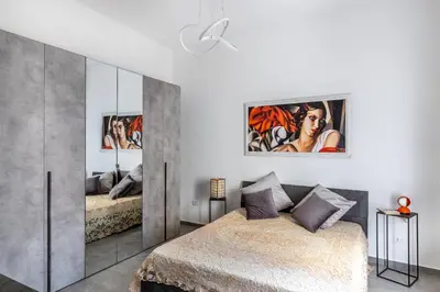 Letto o letti in una camera di Giulia appartamento nuovissimo