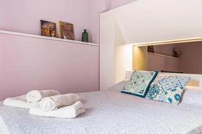 Letto o letti in una camera di Palazzino San Francesco